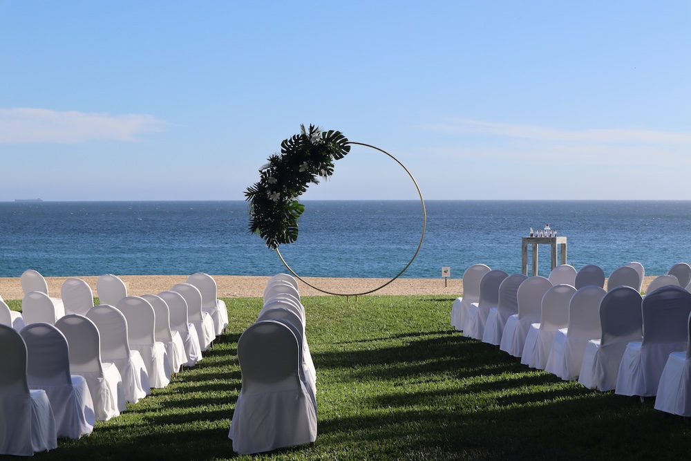 A wedding setup with chairs and photo prop on the beach in Los Cabos, Cabo San Lucas, Mexico